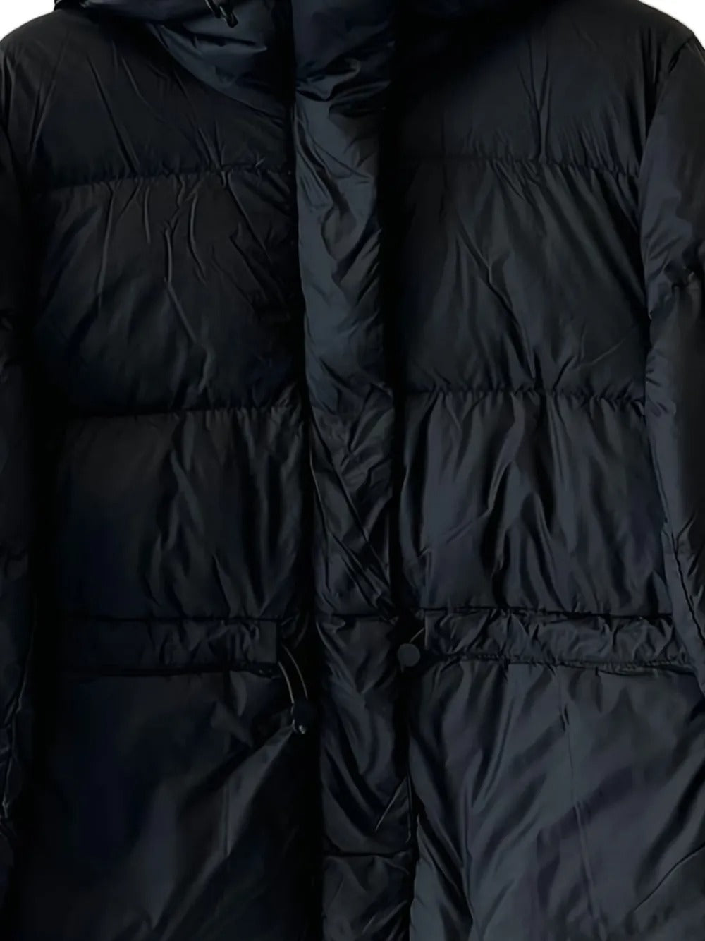 Close up of the black jacket, showing texture of the polyamide fabric