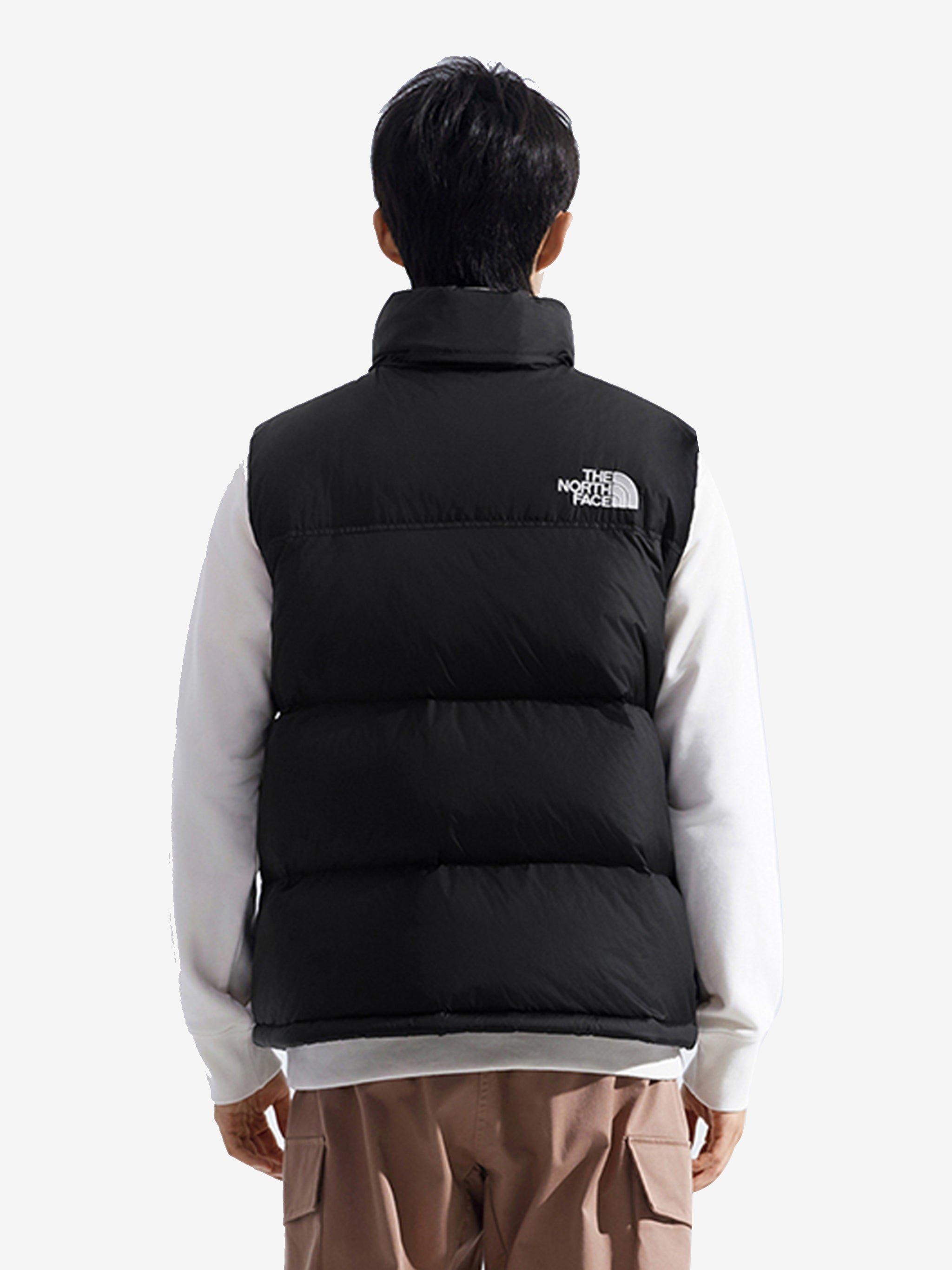 Black vest worn by a person, showing the vest's fit