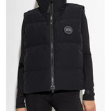 Black vest worn by a person, showing the vest's fit