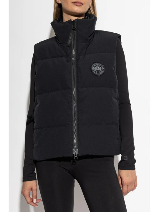 Black vest worn by a person, showing the vest's fit