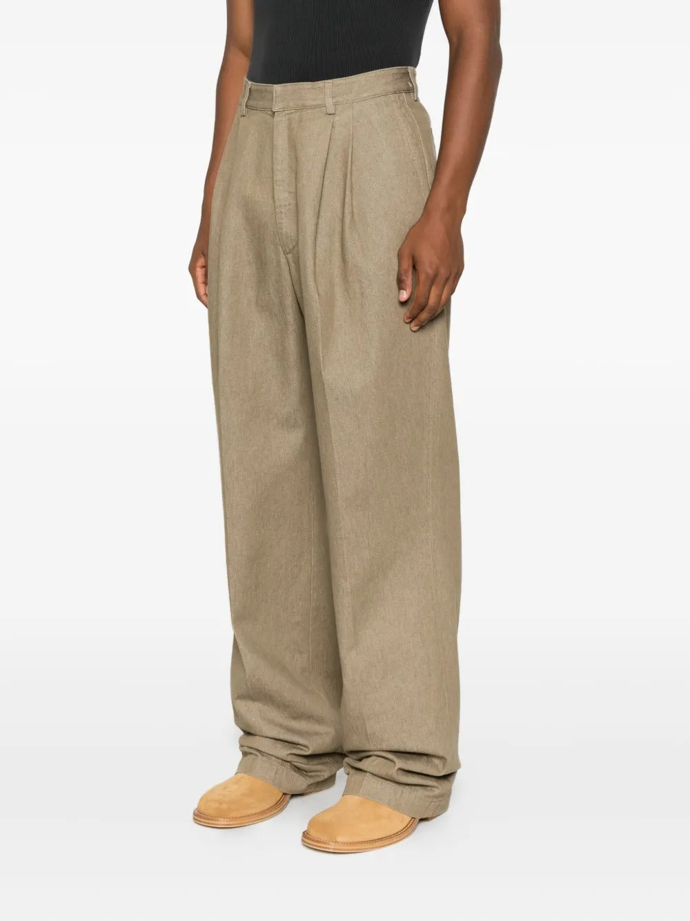 Tan pants worn by a person, showing the pants' fit