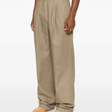 Tan pants worn by a person, showing the pants' fit