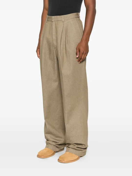 Tan pants worn by a person, showing the pants' fit