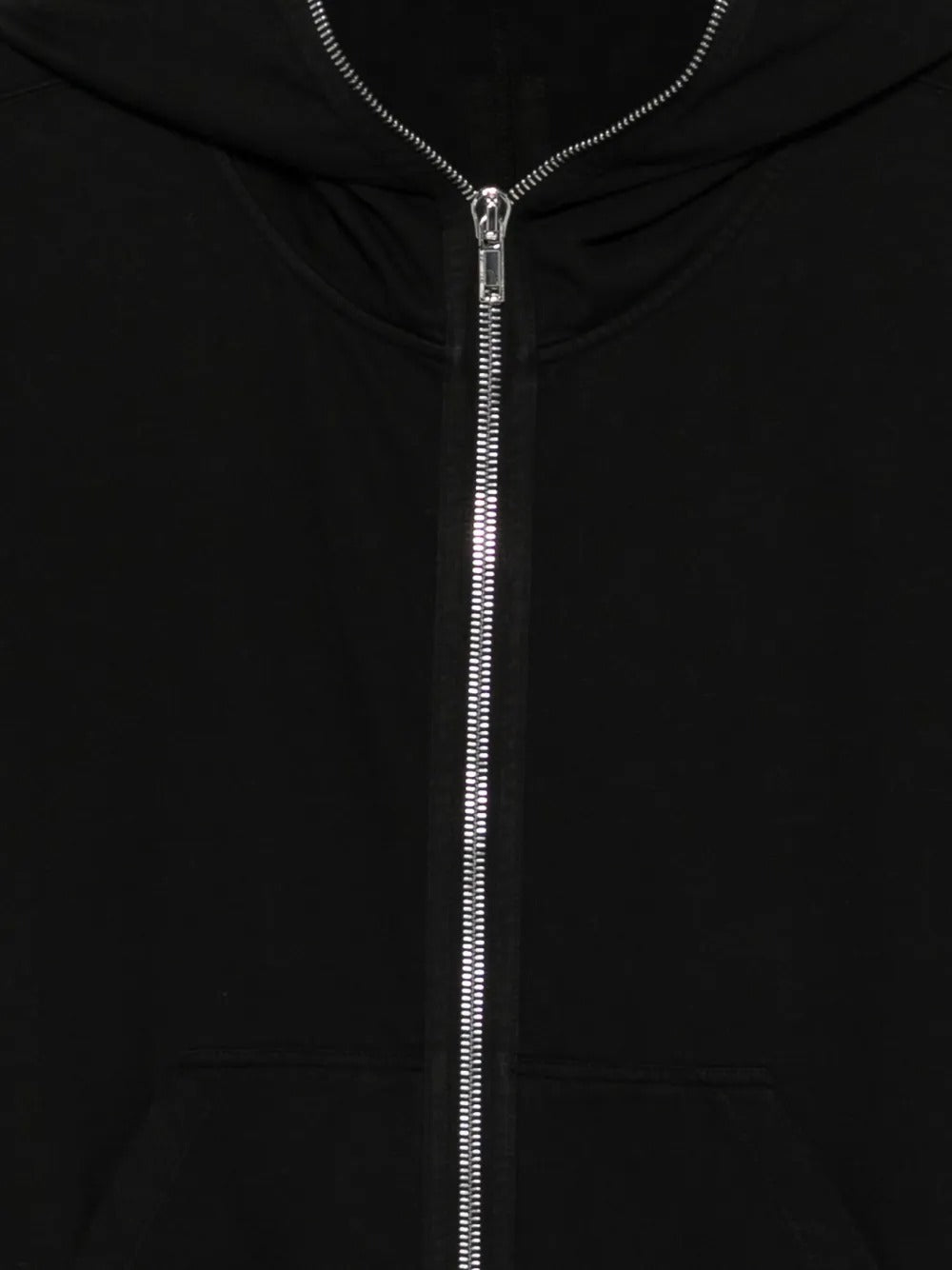 Close up of black hoodie, showing texture of the cotton fabric
