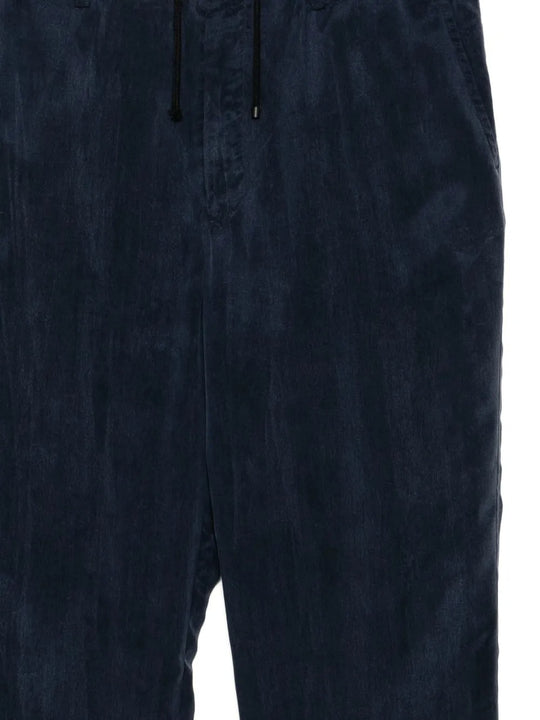 Close up of the navy pants, showing texture of the cupro fabric