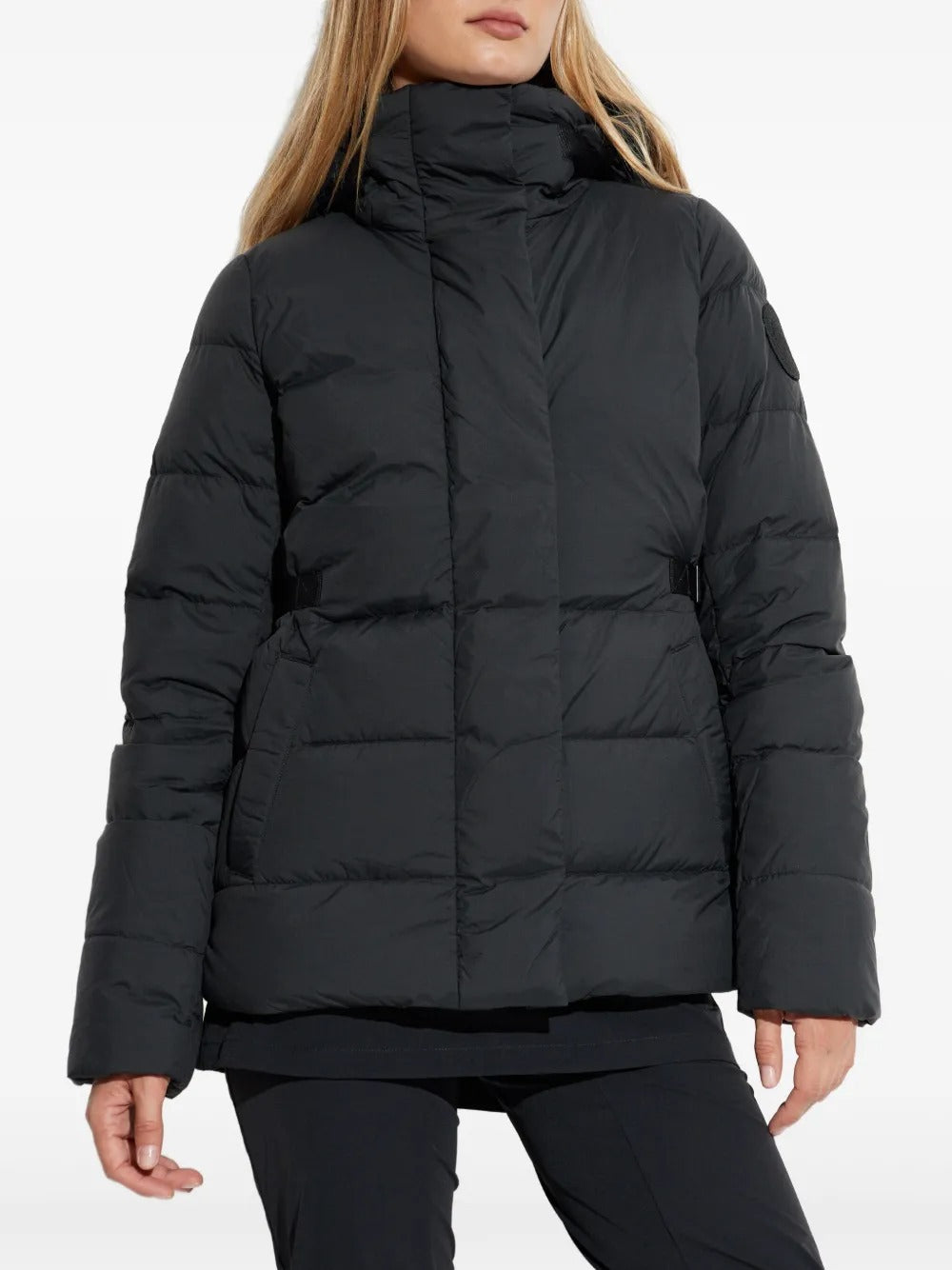 Black jacket worn by a person, showing the jacket's fit