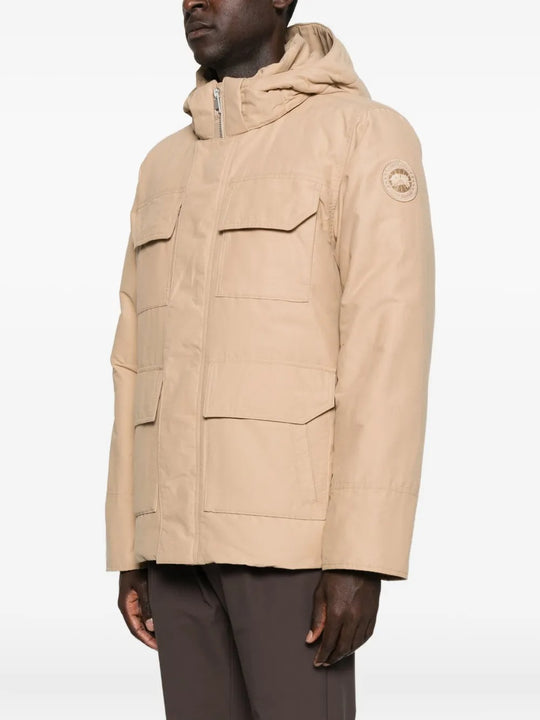 Tan coat worn by a  person, showing the coat's fit