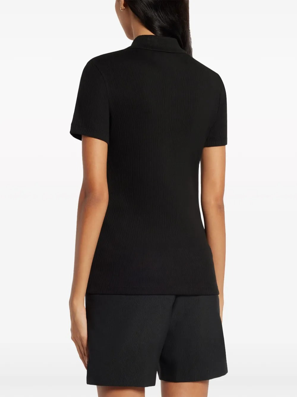 Black T-shirt worn by a person, showing the shirt's fit