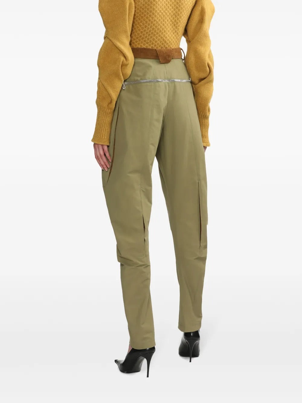 Green pants worn by a person, showing the pant's fit