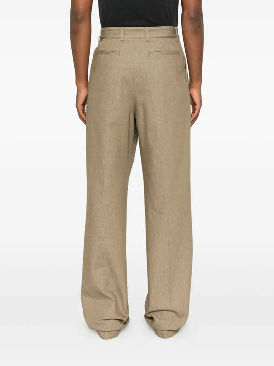 Tan pants worn by a person, showing the pants' fit