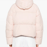 Pink jacket worn by a person, showing the jacket fit