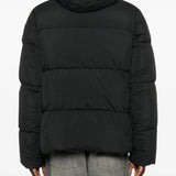 Black coat worn by a person, showing the coat's fit