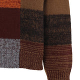 Close up of the yellow sweater, showing texture of the wool fabric