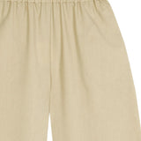 Close up of tan pants, showing texture of the wool fabric