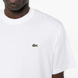 Close up of white T-shirt, showing texture of the cotton fabric