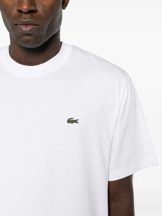 Close up of white T-shirt, showing texture of the cotton fabric