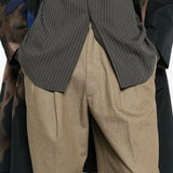 Close up of the tan pants, showing texture of the cotton fabric