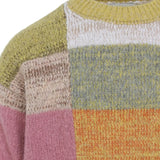 Close up of the yellow sweater, showing texture of the wool fabric
