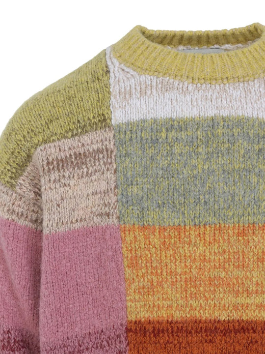 Close up of the yellow sweater, showing texture of the wool fabric