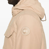 Close up of the tan coat, showing texture of the cotton fabric