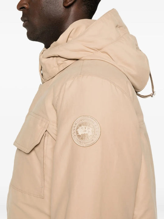 Close up of the tan coat, showing texture of the cotton fabric