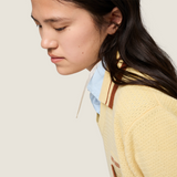 Yellow knitwear, full body view