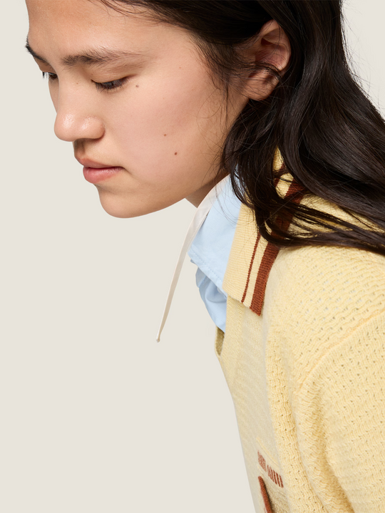 Yellow knitwear, full body view