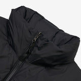 Close up of the black vest, showing texture of the nylon fabric