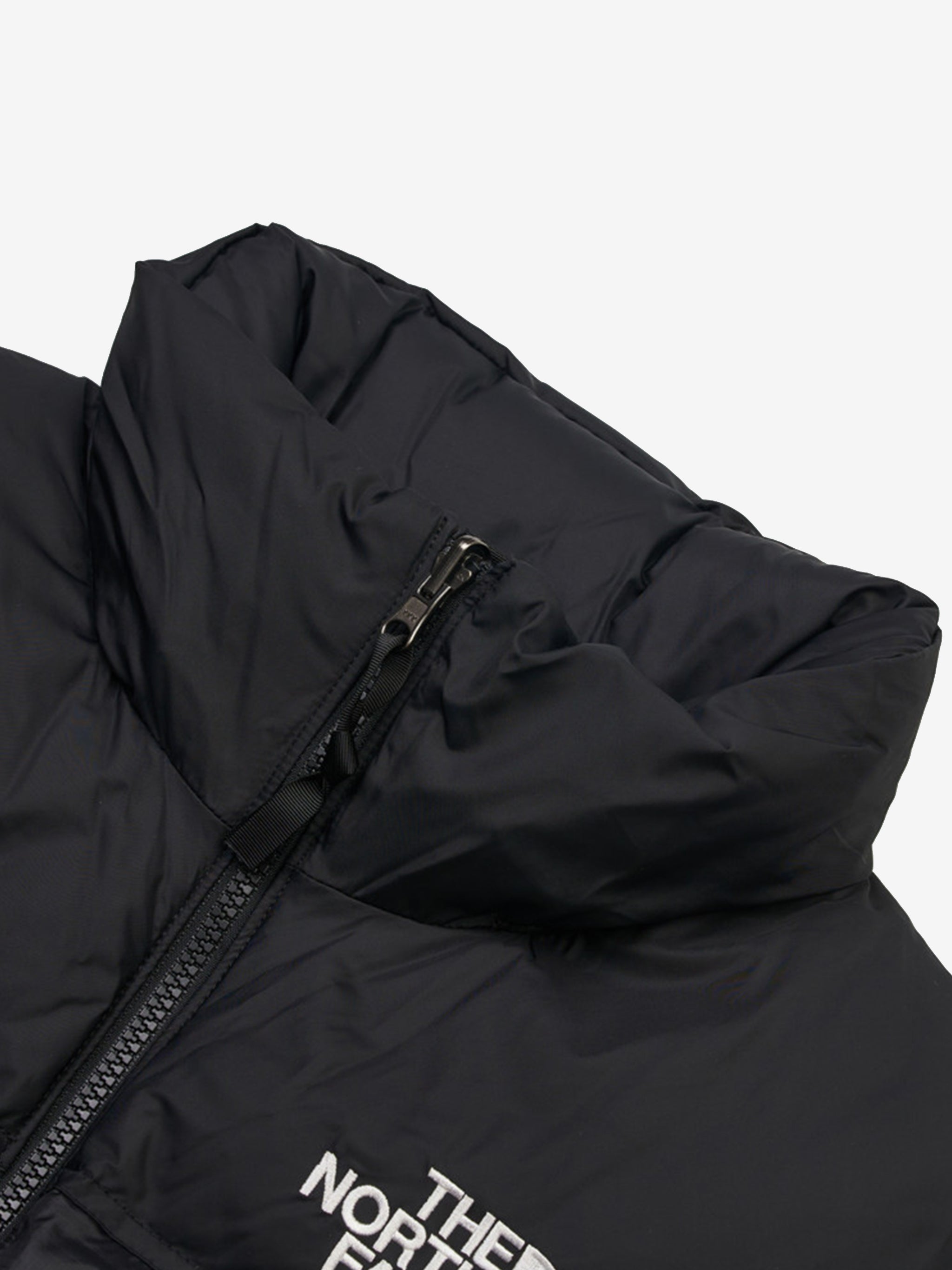 Close up of the black vest, showing texture of the nylon fabric