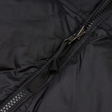 Close up of the black vest, showing texture of the nylon fabric