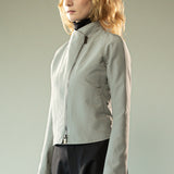 Grey jacket worn y a person, showing the jacket's fit