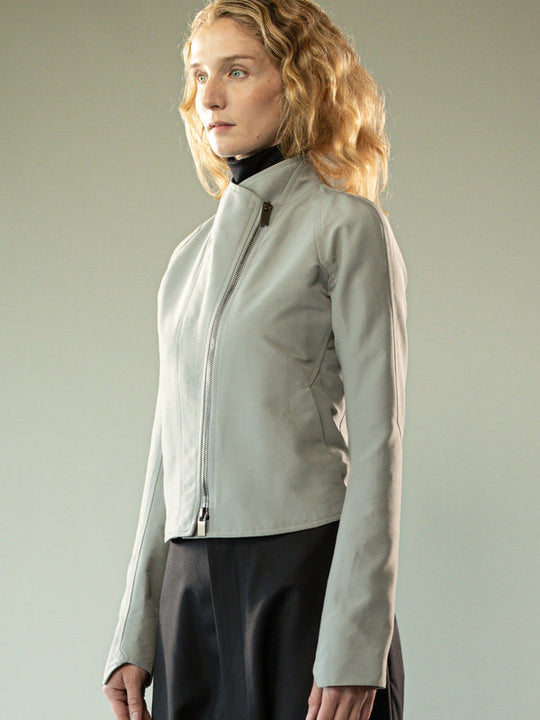 Grey jacket worn y a person, showing the jacket's fit
