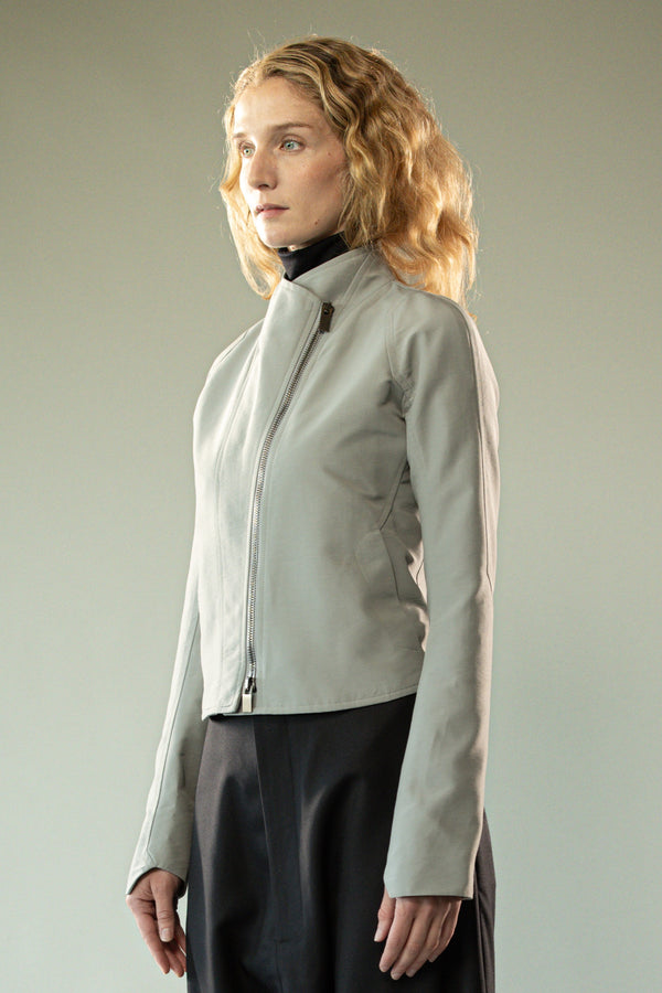 Grey jacket worn y a person, showing the jacket's fit