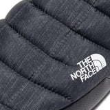 Close up of grey shoes, showing texture of the fabric