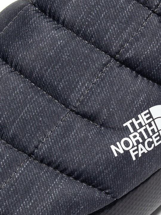 Close up of grey shoes, showing texture of the fabric