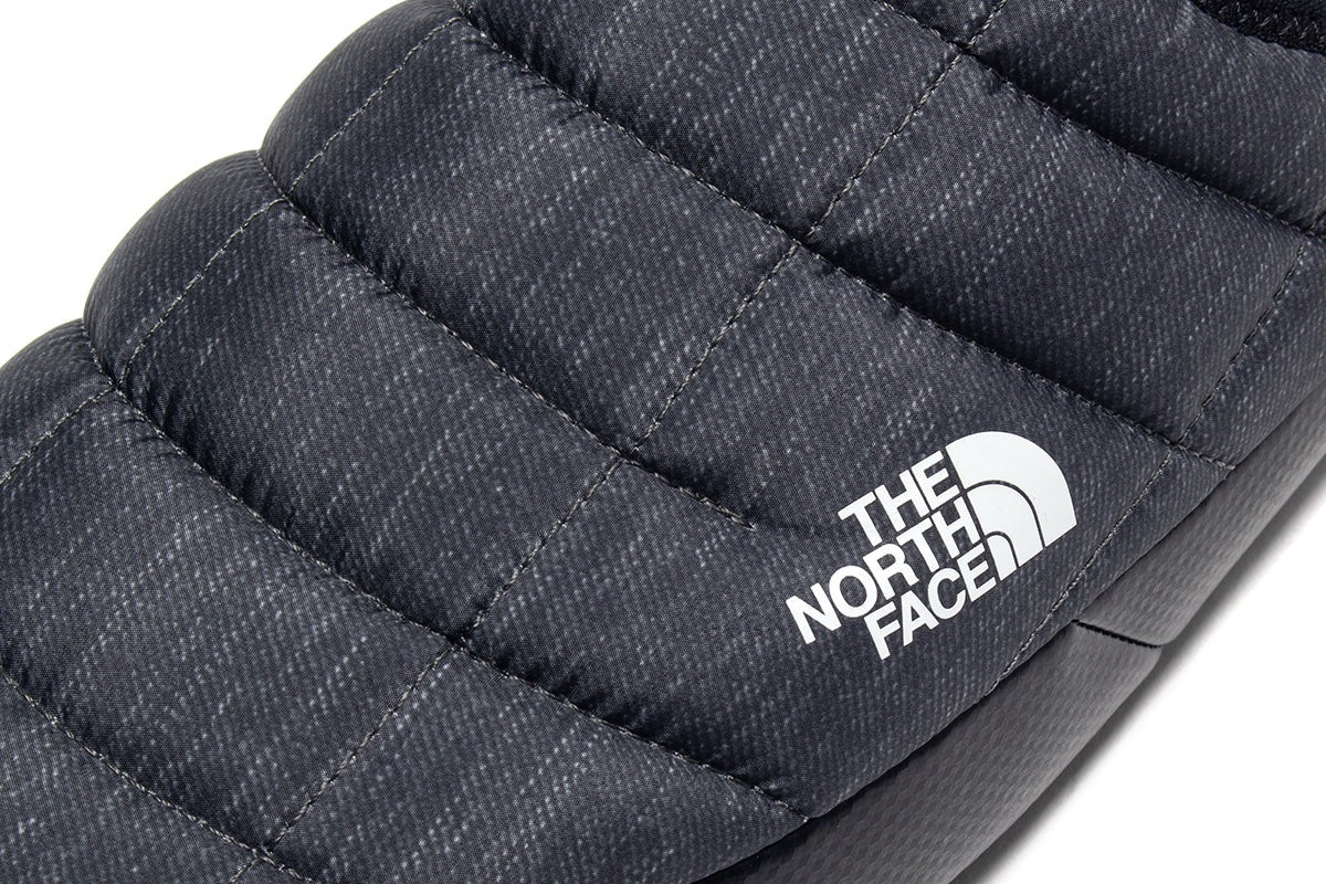 Close up of grey shoes, showing texture of the fabric