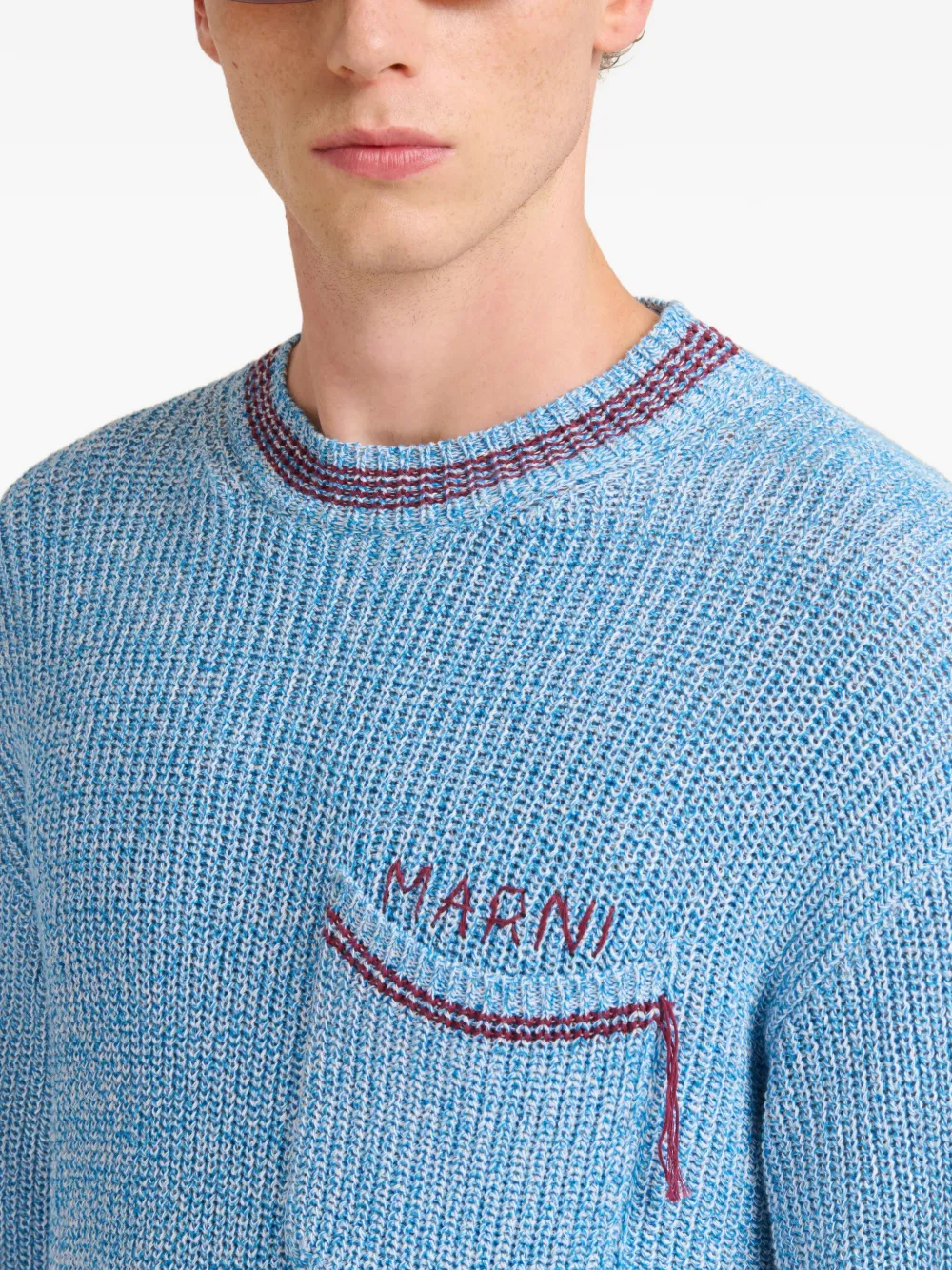 Close up of blue sweater, showing texture of the Cotton fabric