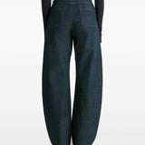 Navy pants worn by a person, showing the pants' fit