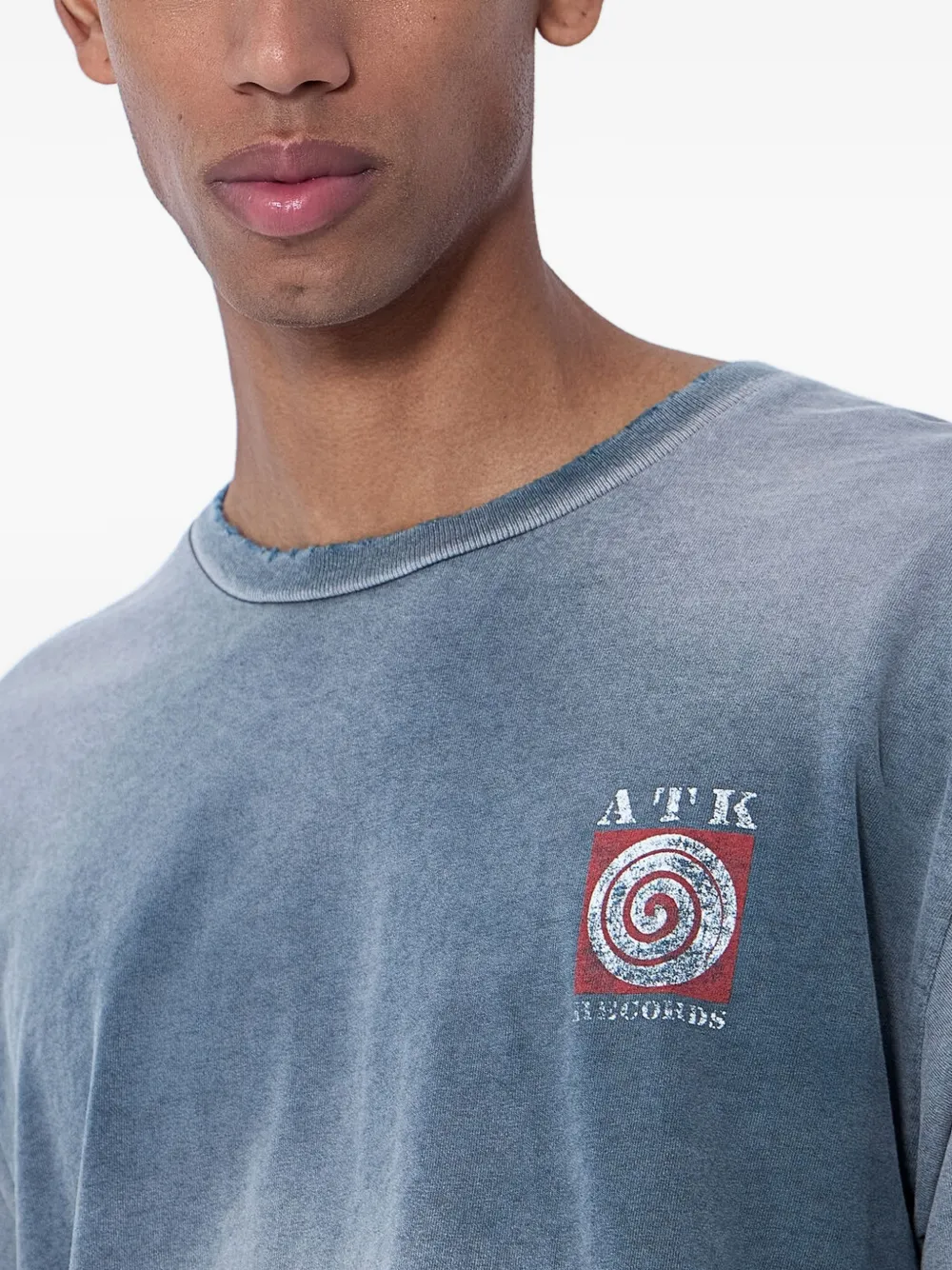 Grey t-shirt worn by a person, showing the t-shirt fit