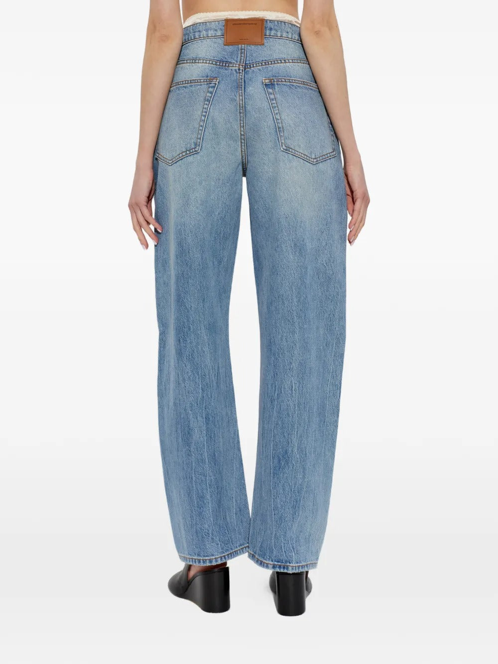 Blue jeans worn by a person, showing the jeans fit