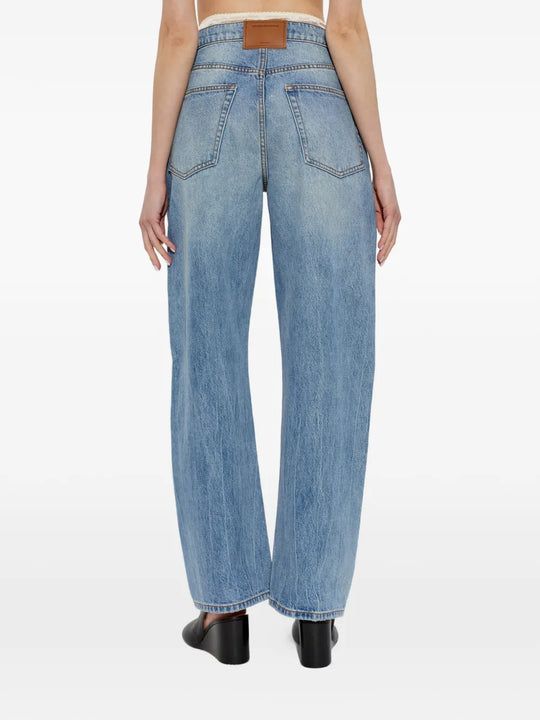 Blue jeans worn by a person, showing the jeans fit