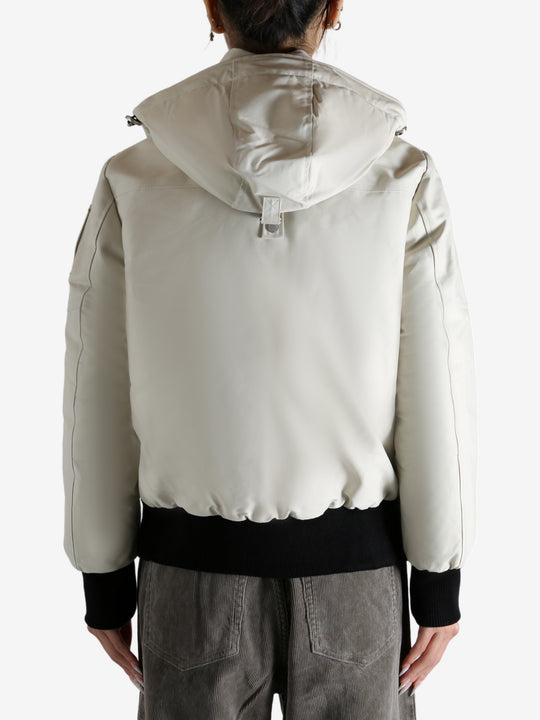 White bomber worn by a person, showing the bomber fit