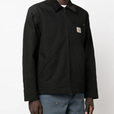 Black jacket worn by a person, showing the jacket fit