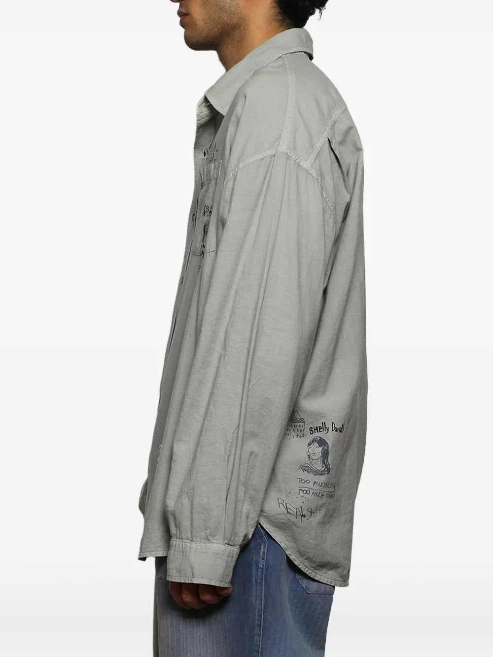 Grey shirts worn by a person, showing the shirts fit