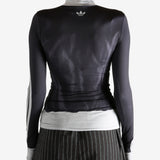 black jacket worn by a person, showing the jacket fit