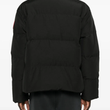 Black jacket worn by a person, showing the jacket fit