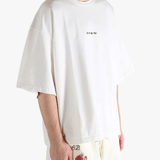 White shirt worn by a person, showing the shirt's fit
