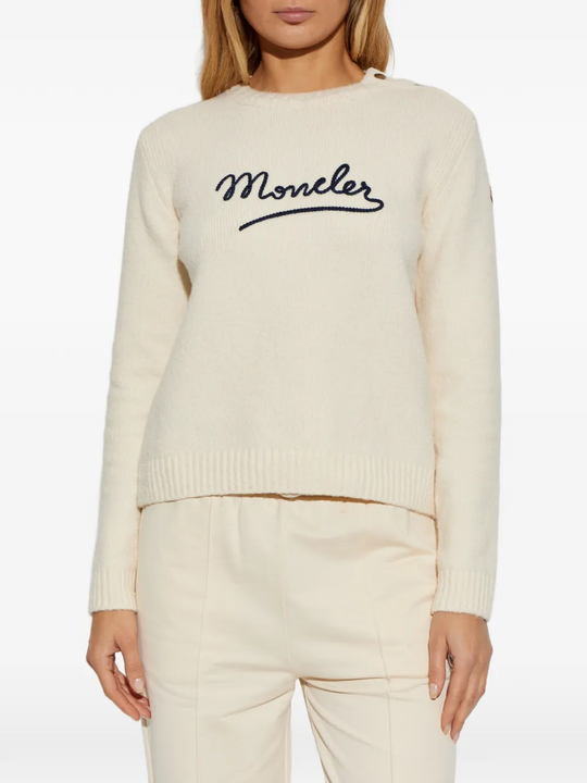 white top worn by a person, showing the top fit