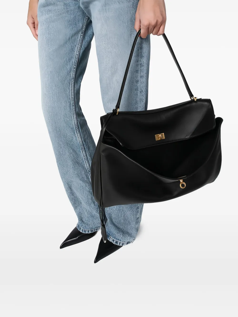 Black bag worn by a person, showing the bag fit