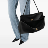 Black bag worn by a person, showing the bag fit